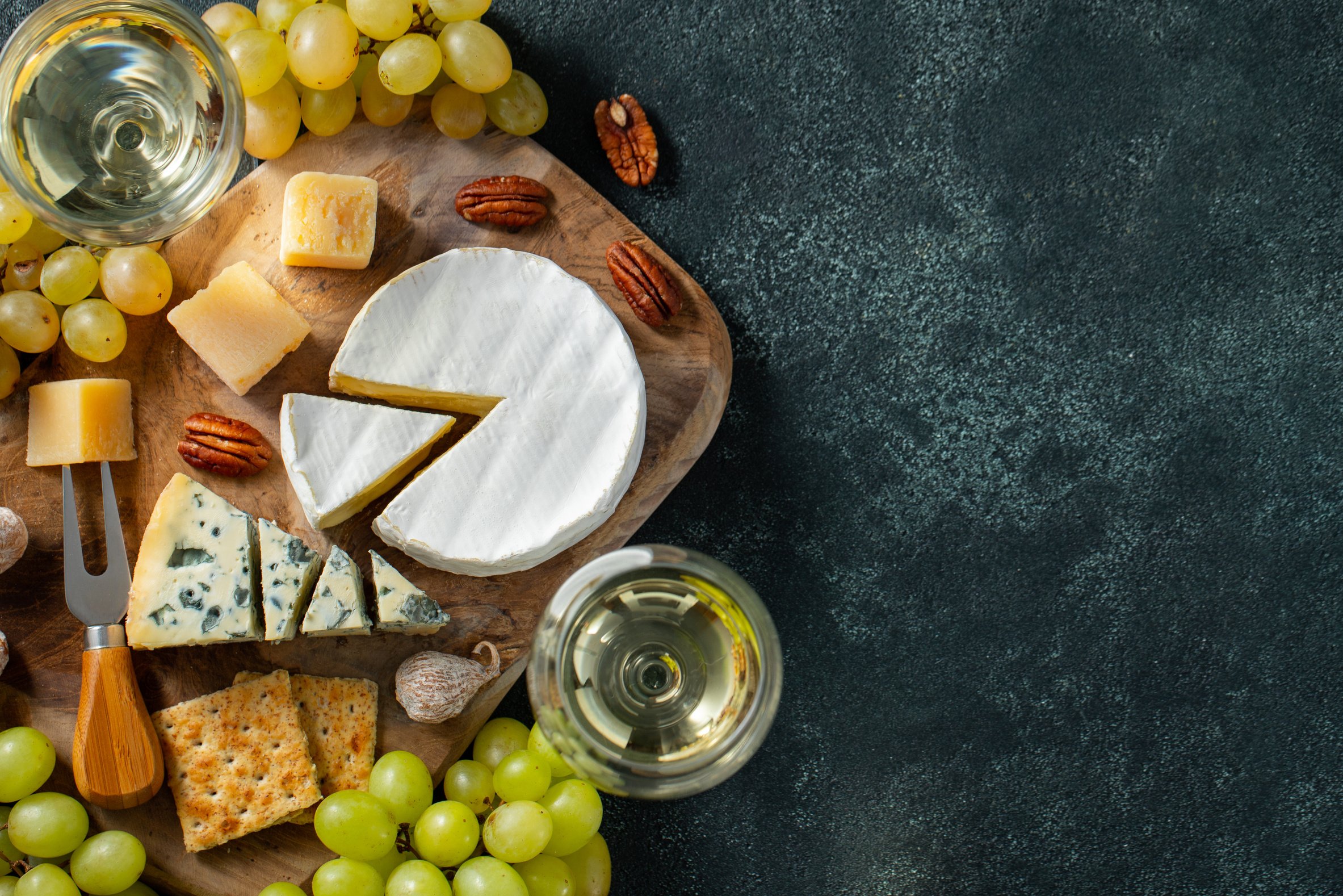 Assorted Cheese with Grapes and Wine Copy Space